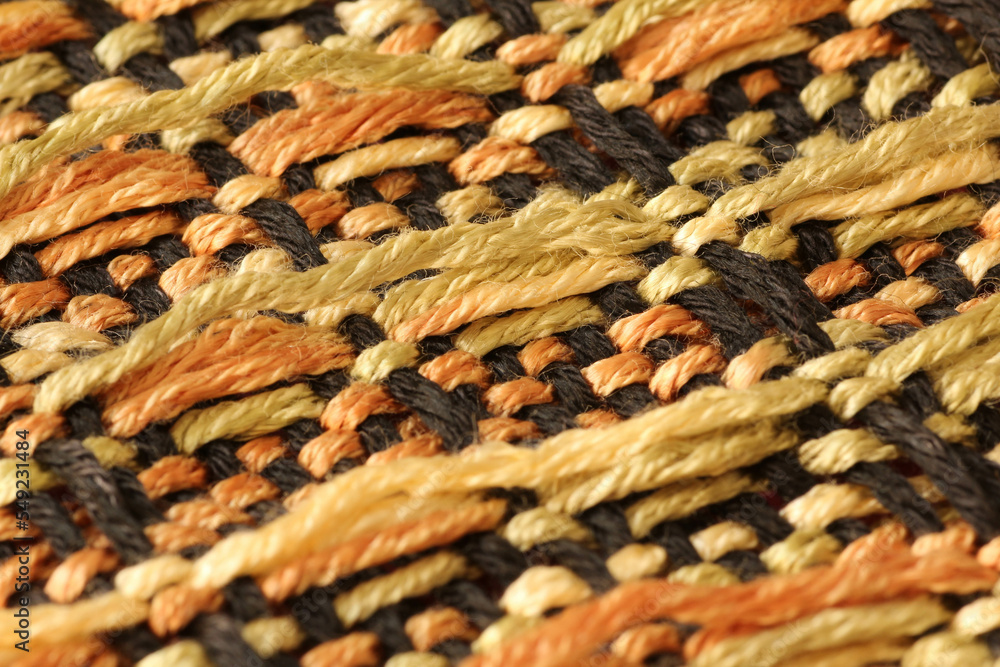 Closeup of handwoven pattern with colorful yarns Closeup of handwoven pattern with colorful yarns
