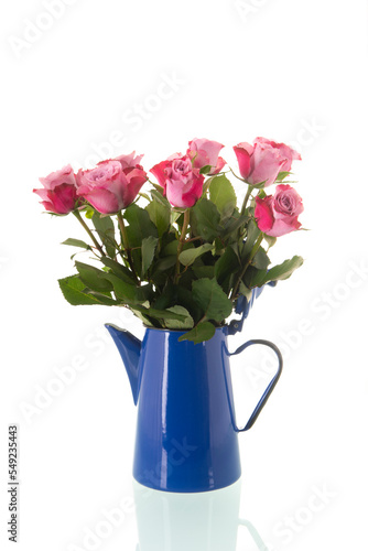 Bouquet pink roses in vintage coffee pot