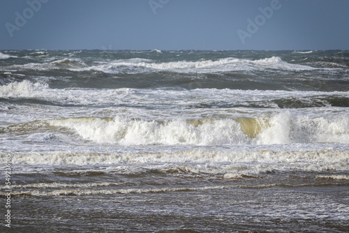 waves crashing on the beach photo