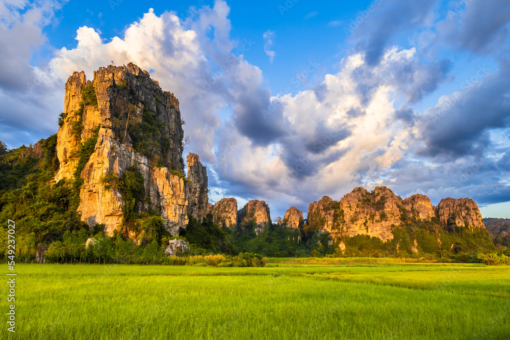 Limestone mountain range along the rice field with beautiful clouds, travel scenic at Noen Maprang district, Phitsanulok, Thailand