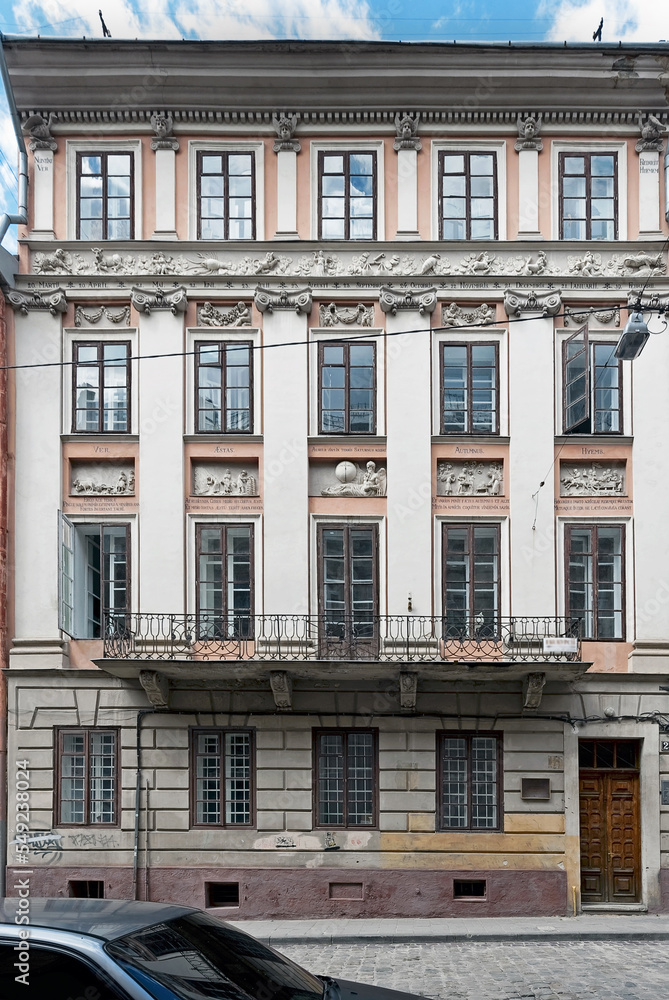 Fototapeta premium Four Seasons House in Lviv, Ukraine. Its facade depicts twelve zodiac signs, the four seasons and Chronos reliefs and Latin sayings