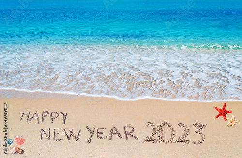 happy new year 2023 written on the shore © Gabriele Maltinti