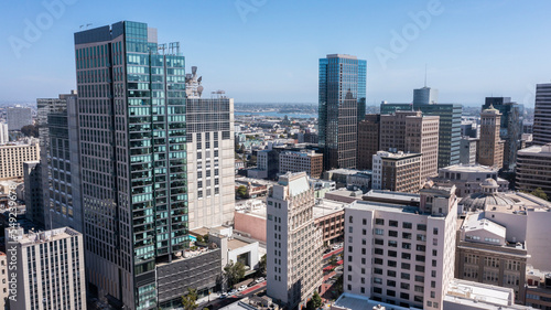 Afternoon skyline aerial view of the urban core of downtown Oakland, California, USA.