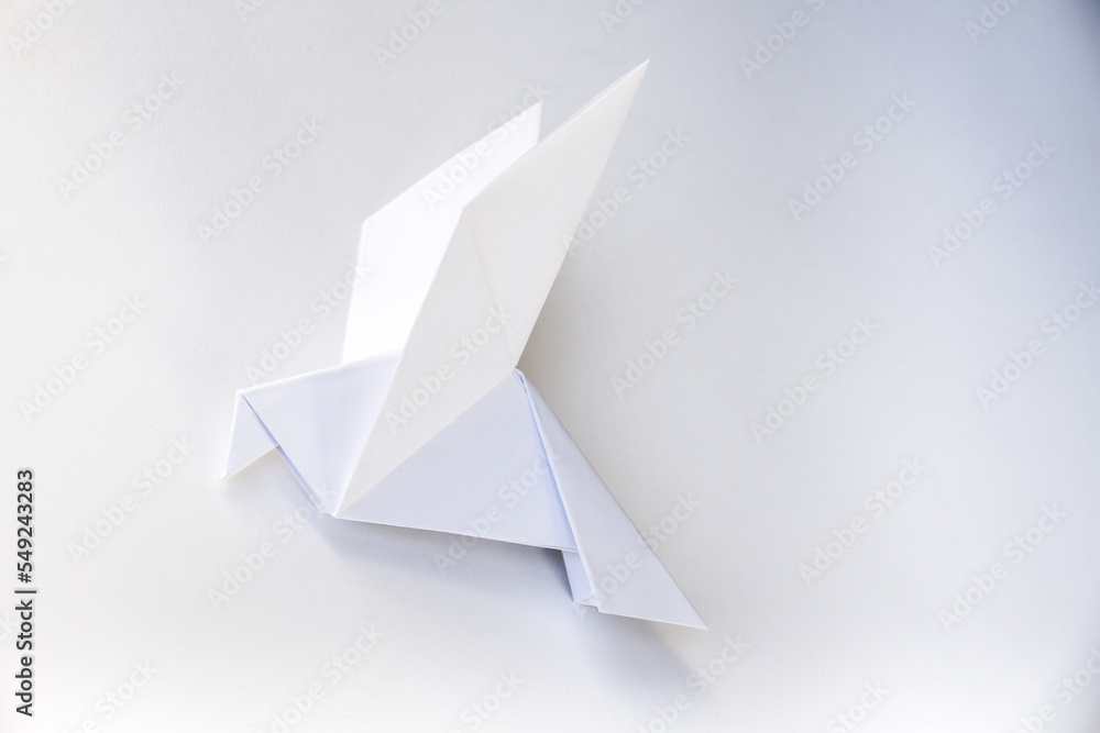 Paper dove origami isolated on a white background Paper dove origami isolated on a white background