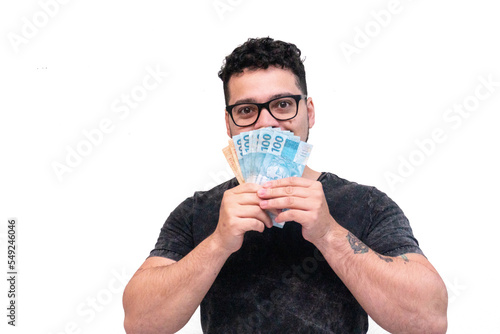 homem segurando dinheiro na frente do rosto man holding money in front of face photo