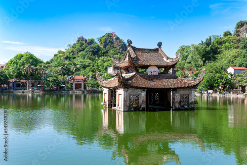 Fotografiet An ancient water puppet stage in a lake in front of Thay Pagoda in Hatay district of Hanoi