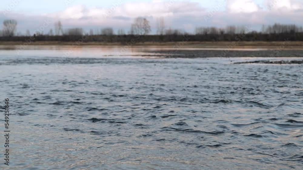 Calm river. Great view of the flowing river water. General plan of abundant water flow Calm river. Great view of the flowing river water. General plan of abundant water flow