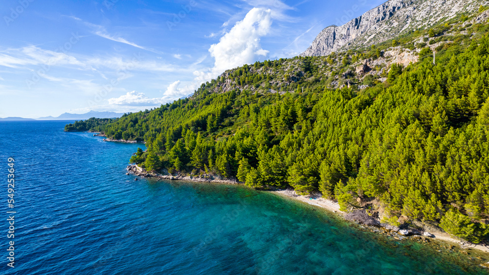 Croatia. Aerial view on beach and people. Vacation and relax. Beach and blue water. Top view from drone at beach and azure sea. Travel and holiday