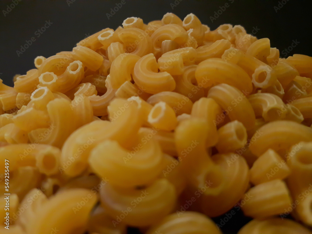 Macaroni on black background Macaroni on black background