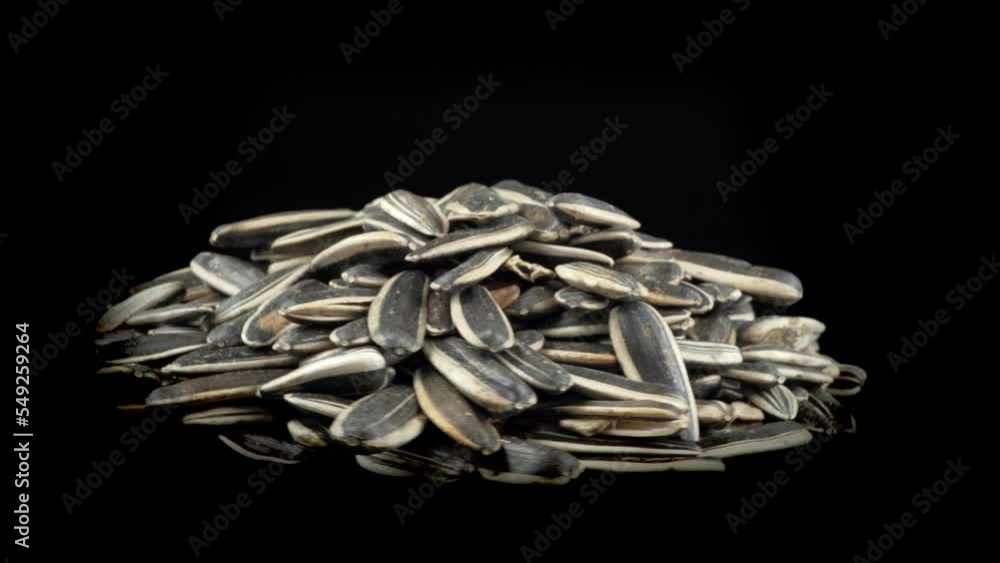 sunflower seeds rotate on a black background sunflower seeds rotate on a black background