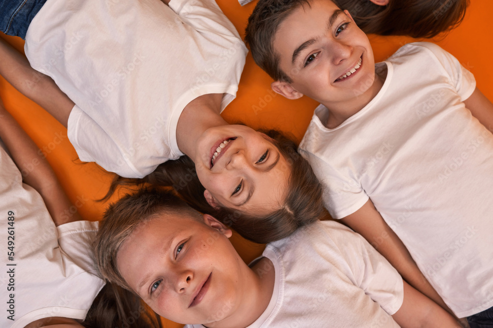 Cropped top of smiling children looking at camera