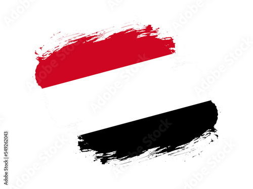 Stroke brush textured flag of yemen on white background photo