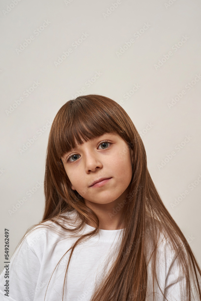 Cropped of serious little girl looking at camera