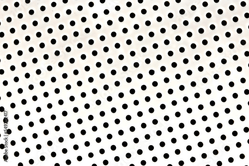 Metal background with holes close up. Perforated metal surface