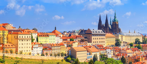 Summer cityscape, panorama, banner - view of the Hradcany historical district of Prague and castle complex Prague Castle, Czech Republic photo