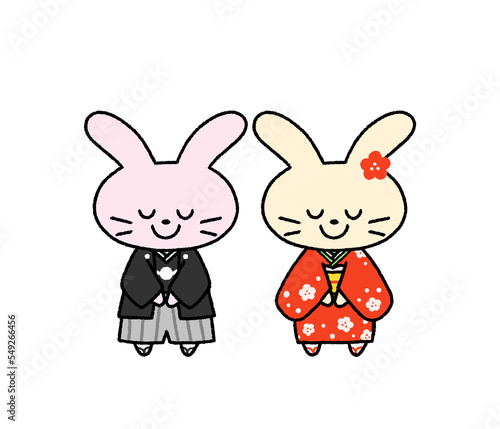 和服を着て正月の挨拶をする2羽のウサギ