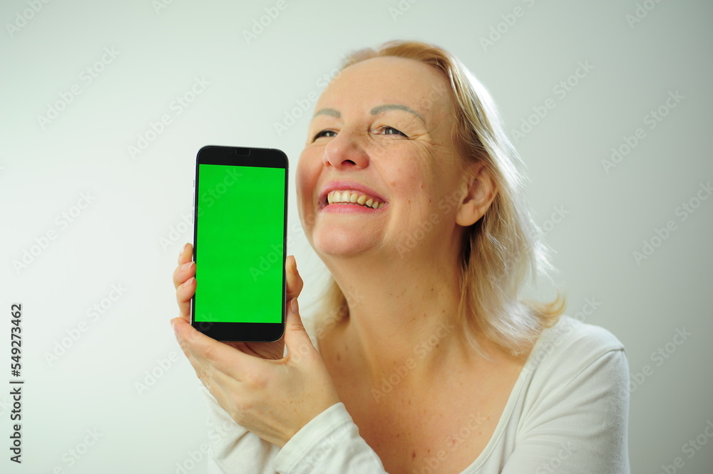 Winning to find what to look for joy happiness different emotions Chroma Key Phone green screen space for advertising Photo of woman in white shirt on a white background Beautiful adult happy woman