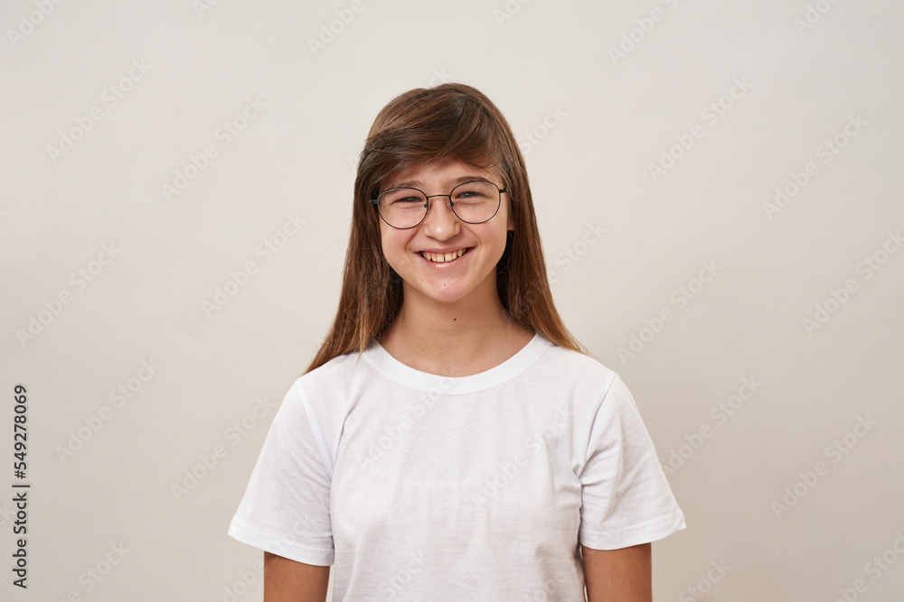 Front view of smiling teenage girl look at camera Front view of smiling teenage girl look at camera