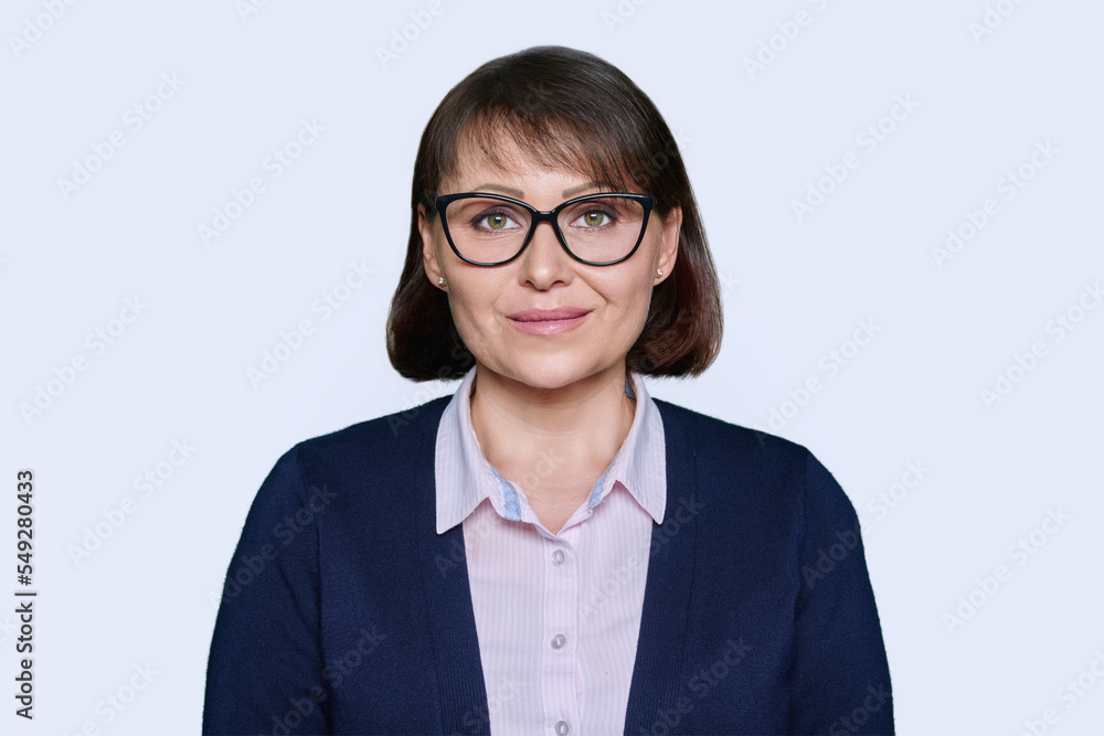 Portrait of business smiling woman looking at camera, white background Portrait of business smiling woman looking at camera, white background