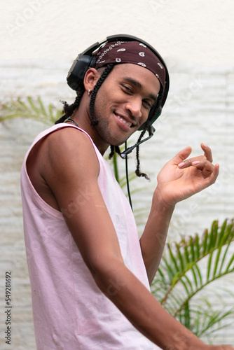 Portrait young afro american man have fun listening to music. Portrait Photo