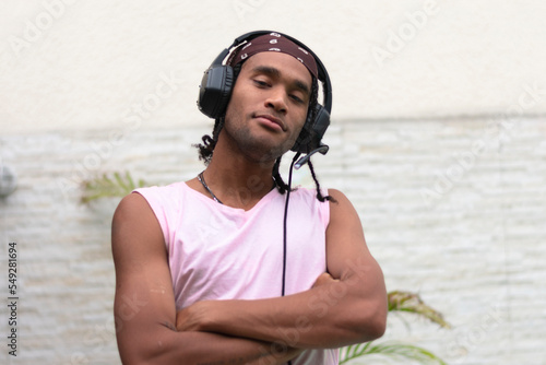 Portrait young afro american man have fun listening to music. Landscape photo