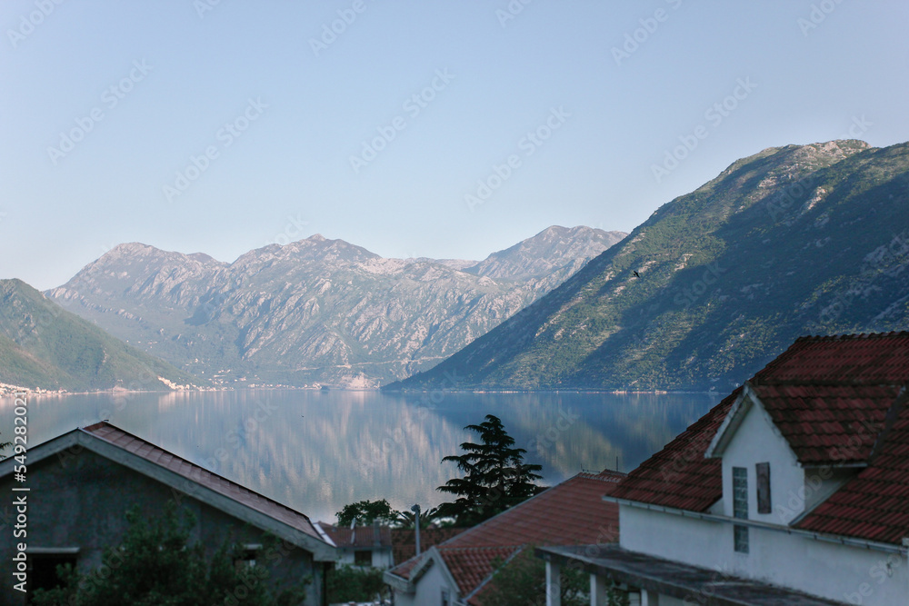 view of the bay of montenegro with roofs of houses view of the bay of montenegro with roofs of houses
