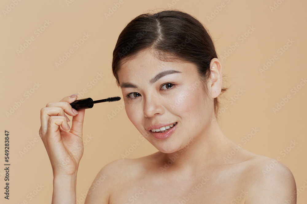Fototapeta premium Portrait of modern asian woman with mascara