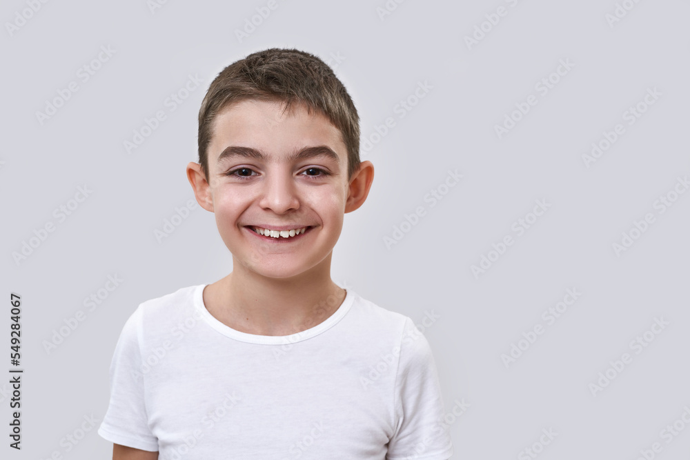 Smiling caucasian little boy looking at camera Smiling caucasian little boy looking at camera