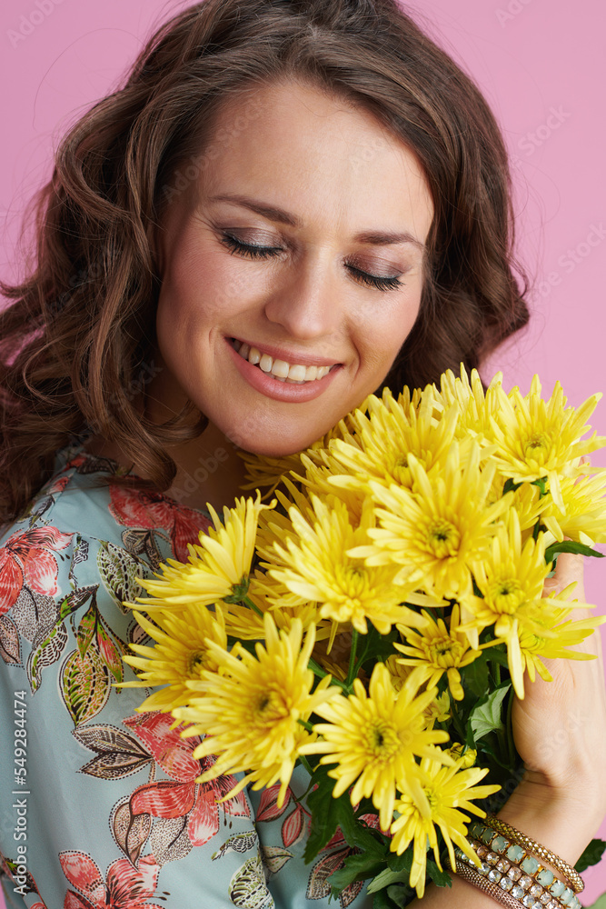 happy stylish woman in floral dress on pink happy stylish woman in floral dress on pink