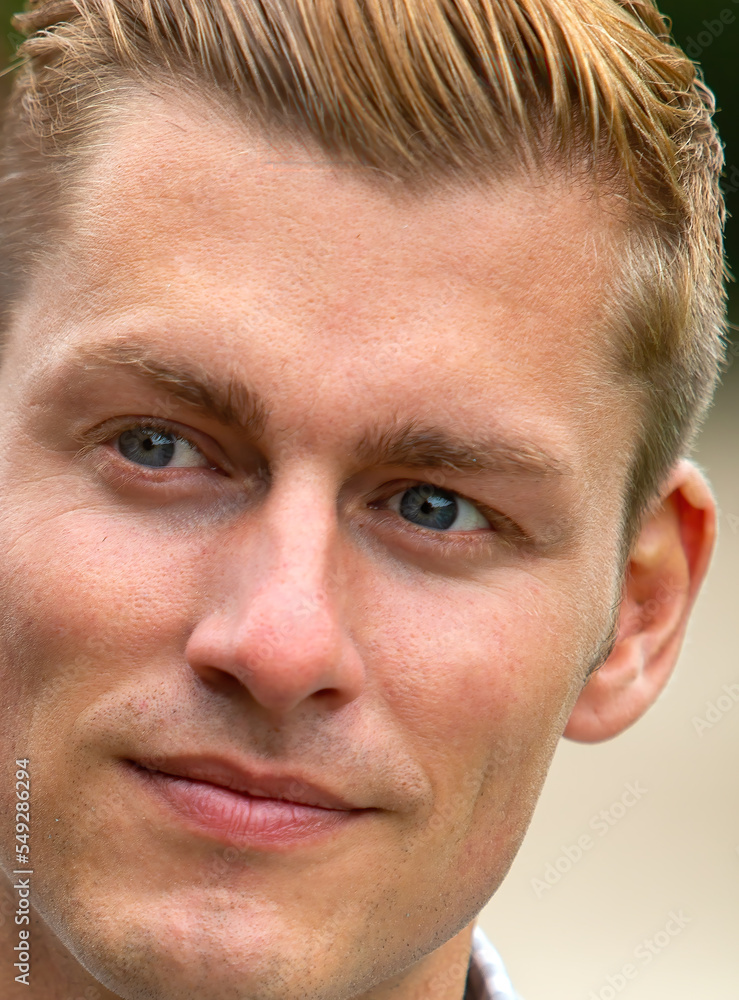 close-up of a handsome young blond man close-up of a handsome young blond man