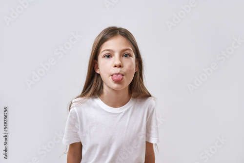 Fotografie Cropped of caucasian little girl stick out tongue