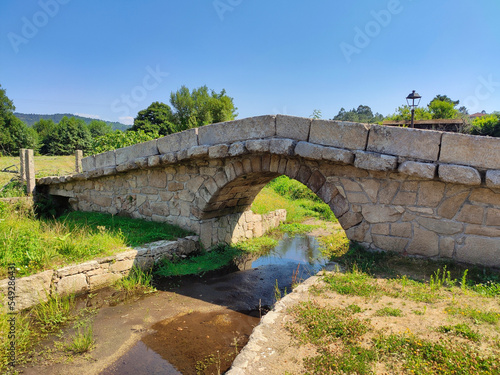 Augapesada roman bridge, Ames municipality, in the way to Fisterra from Santiago, Way to Saint James, Galicia, Spain photo