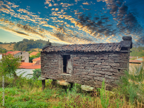 Dry-stone granary called horreo in Lago village, Mazaricos municipality, Way to Saint James, Galicia, Spain photo