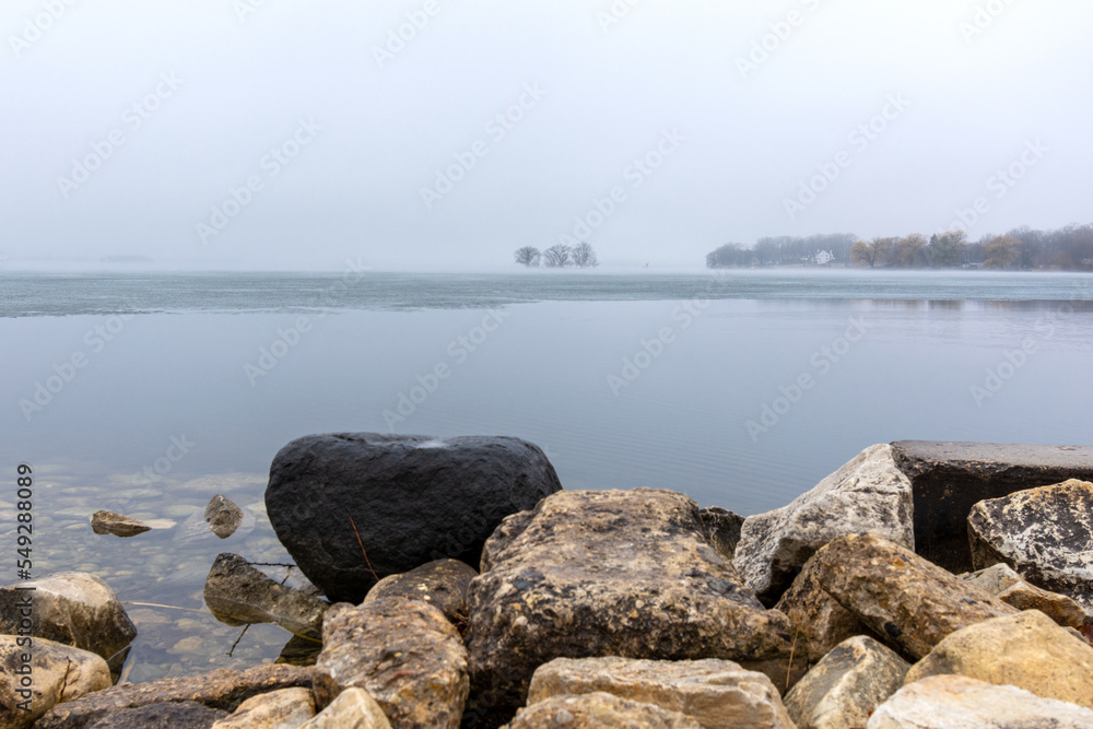 Looking out onto Pewaukee Lake on a foggy March morning. Looking out onto Pewaukee Lake on a foggy March morning.