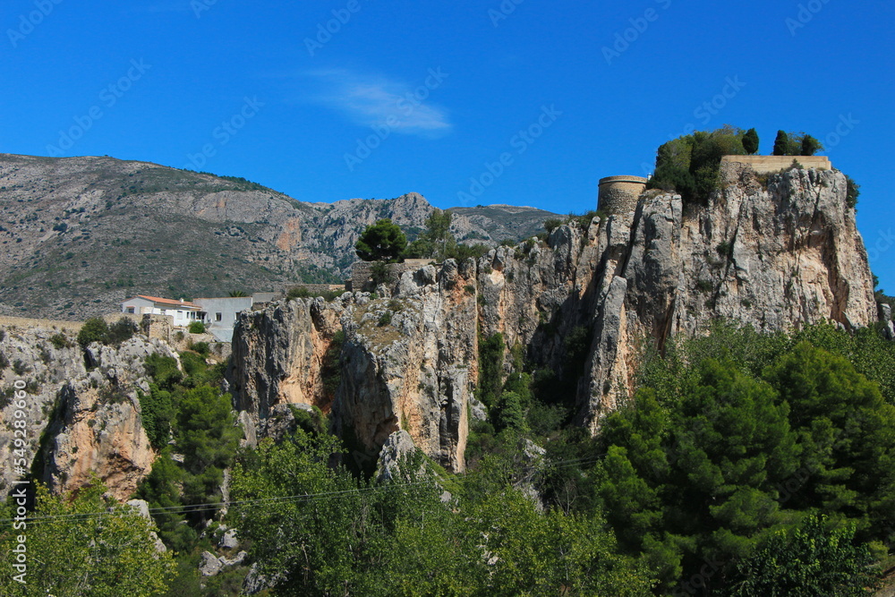 Guadalest castle on the topmost part of the cliff with castle buildings