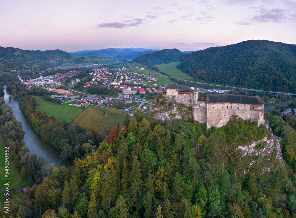 Naklejka premium Old castle on a hilltop backdropped by a village