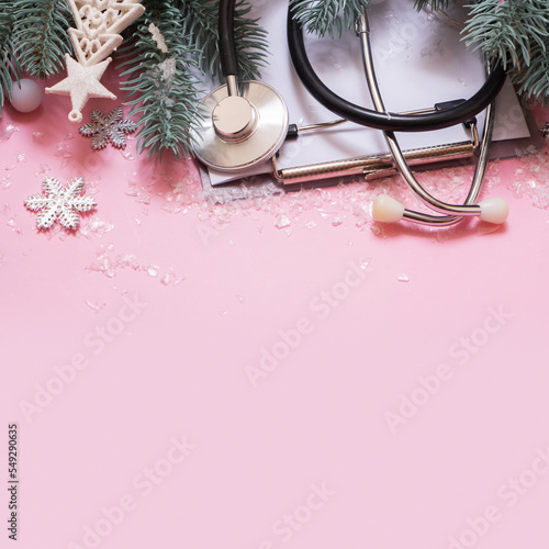 Medical Christmas background with copy space. Medical tools and Christmas decorations and snow top view