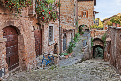 Fototapeta Naklejka Na Ścianę i Meble -  Barbarano Romano, Viterbo, Lazio, Italy: picturesque corner, narrow alley, ancient houses in the old town of the medieval village