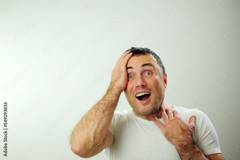 adult-handsome-man-with-beard-wearing-white-t-shirt-on-a-white