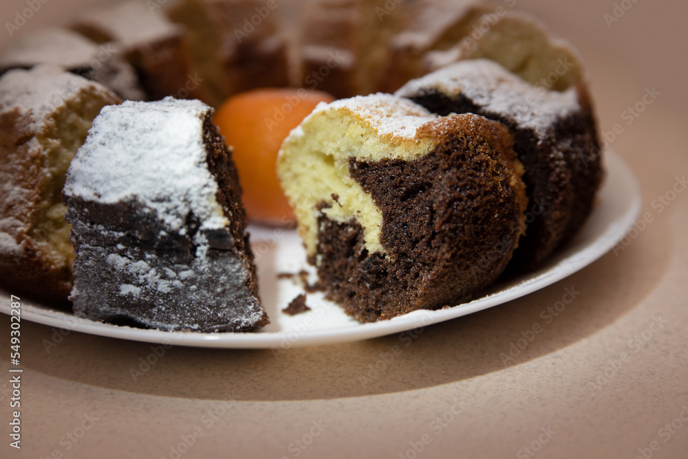 Fresh homemade baking, yellow and dark chocolate cupcake, baking texture, focus on the chocolate part of the cupcake. Homemade pastries made with love Fresh homemade baking, yellow and dark chocolate cupcake, baking texture, focus on the chocolate part of the cupcake. Homemade pastries made with love