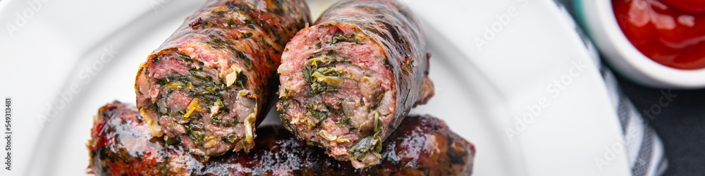sausage fresh ground meat greens herbs pork, beef, chicken delicious snack healthy meal food snack on the table copy space food background rustic top view sausage fresh ground meat greens herbs pork, beef, chicken delicious snack healthy meal food snack on the table copy space food background rustic top view
