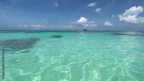 Azure water of the Indian Ocean against the blue sky. Recreation and tourism concept. Horizontal video