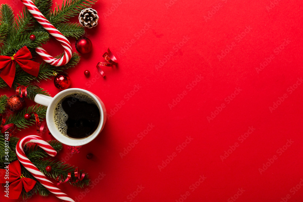 Delicious fresh festive morning coffee in a ceramic cup with little wrapped gifts, ornament and xmas toy. Cup of coffee and new year toys - obrazy, fototapety, plakaty 