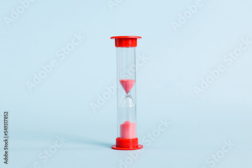 hourglass on the table, sand clock as time passing concept for business deadline, copy space