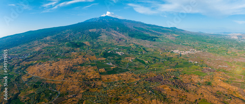 Panoramic aerial wide view of the active volcano Etna, extinct craters on the slope, traces of volcanic activity © ingusk