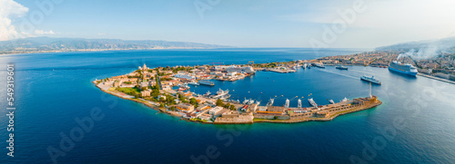 Messina, Sicily, Italy, August 20, 2022. View of the Messina's port with the gold Madonna della Lettera statue photo