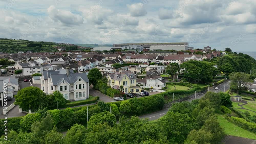 Aerial photo of Residential homes and business Streets and trees in Larne Town County Antrim Northern Ireland Aerial photo of Residential homes and business Streets and trees in Larne Town County Antrim Northern Ireland