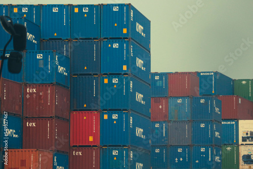 jakarta, Indonesia in October 2022. Stacks of containers of various colors are in an export-import warehouse.