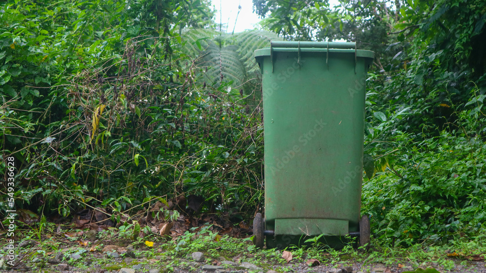 green trash can in tourist spot green trash can in tourist spot