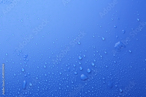 Water drops on blue background  top view